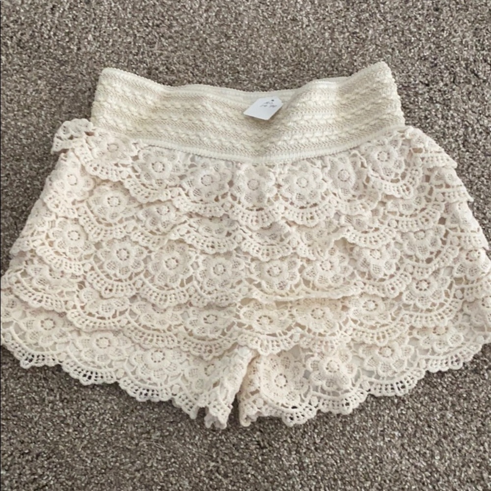 Cream crochet lace tiered shorts